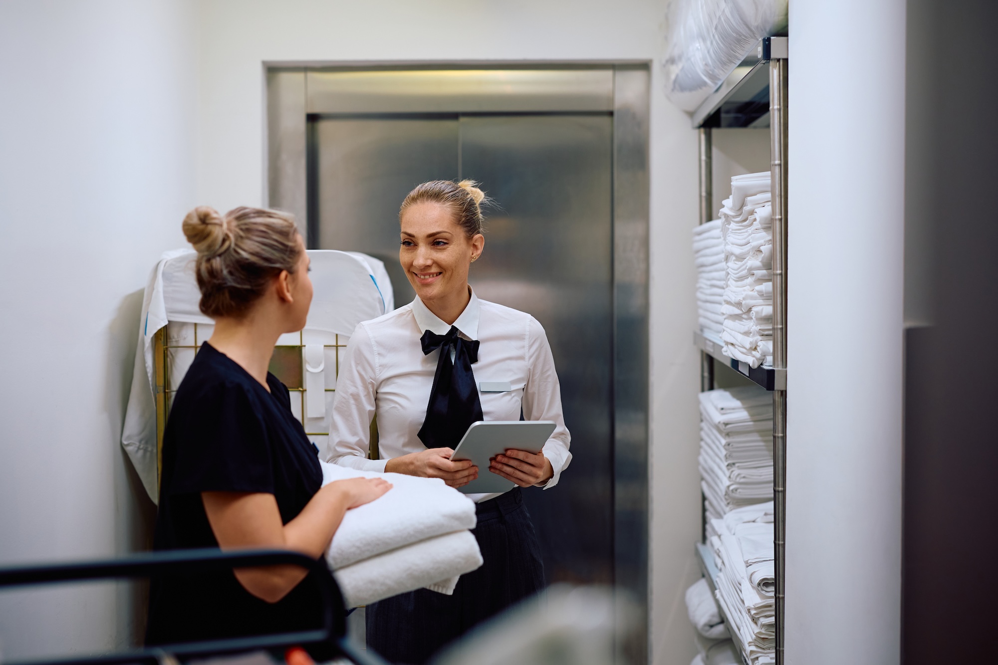 hospitality employees happily working at a hotel that must display labor law posters